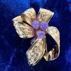 Beautiful gold ribbon brooch